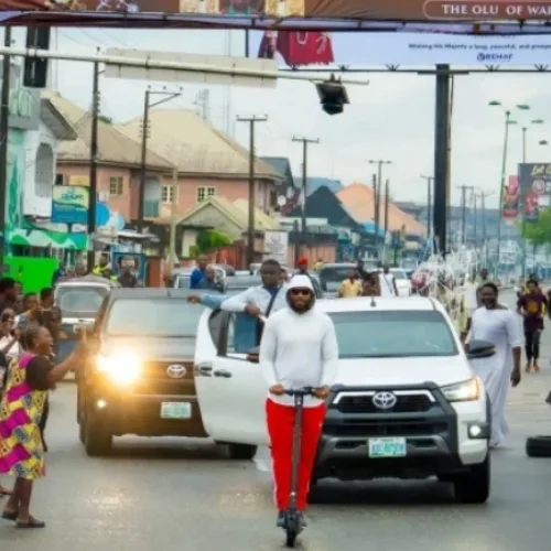 Digital Monarch: Olu of Warri turns heads as he rides scooter round town