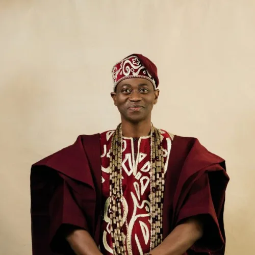 Lateef Adedimeji’s Wine Agbada Look Is Everything We Love About Nigerian Menswear