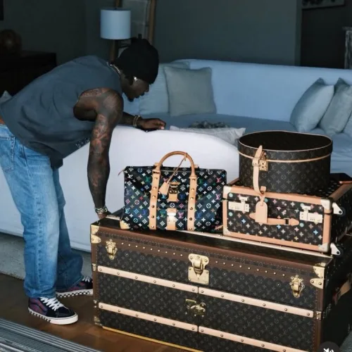 Fans react as Asake flaunts Louis Vuitton trunk worth over N90m