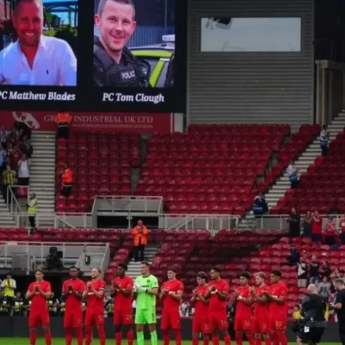 Football fans pay tribute to two officers killed in crash